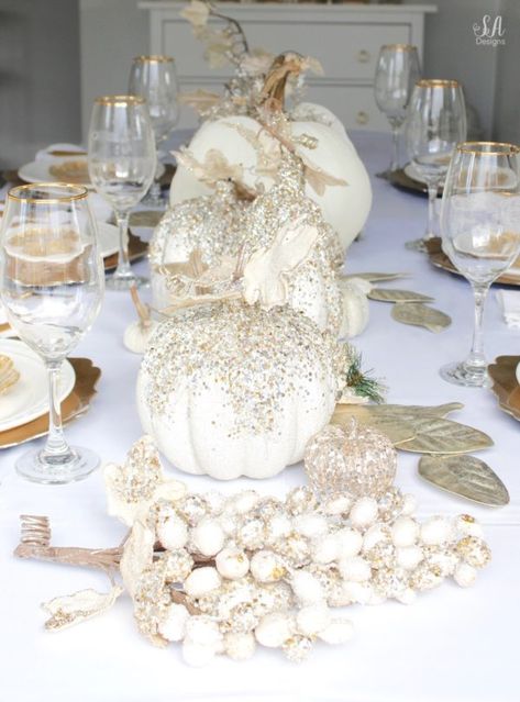 Thanksgiving table, fall table, fall tablescape, white and gold table setting place setting, elegant thanksgiving decor, chic glam thanksgiving decor, zgallerie beaded pumpkins and gourds and leaves, hotskwash velvet pumpkins, white gold champagne ivory tablescape, crystal chandelier, white kitchen design, brass pendant lights, brass hardware, vintage dining set, french inspired style, live in perigold, zgallerie beaded leaves and grape clusters Gold And White Fall Decor, White Gold Kitchen Decor, Gold Thanksgiving Table, Glam Fall Decor, Thanksgiving Table Settings Elegant, Elegant Thanksgiving Table, Elegant Fall Decor, Elegant Table Settings, Fall Decor Inspiration