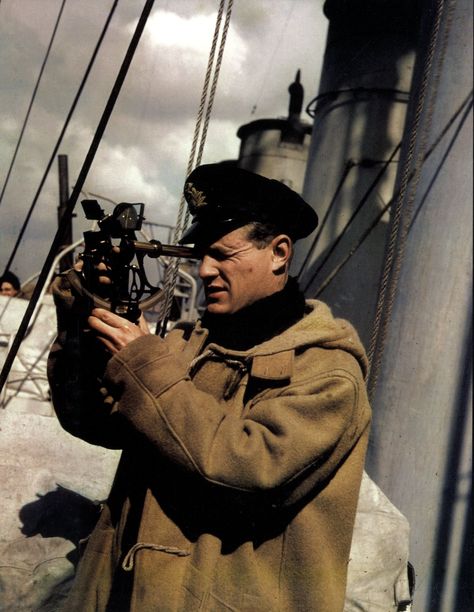 Royal Navy officer takes a bearing with the sextant. He wears the classic Montgomery duffle coat. The Montgomery took its name from the manufacturing company chosen by the Admiralty in the late 1890s to provide crews with a heavy all-weather coat. Gloverall Duffle Coat, Sailor Aesthetic, Royal Navy Officer, Naval Officer, Duffel Coat, Merchant Navy, British Heritage, Duffle Coat, On A Boat