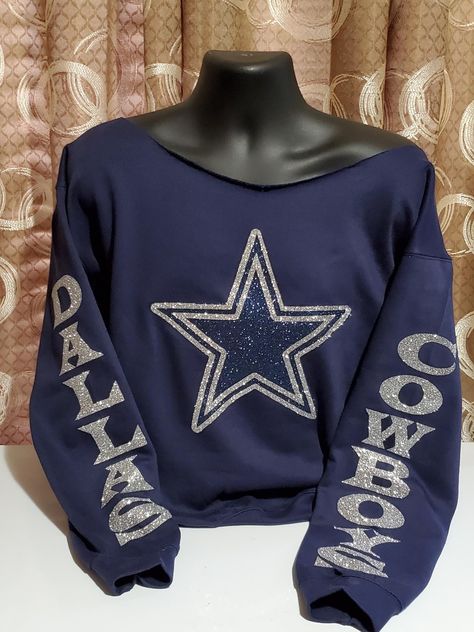 Thanks for stopping by Higherleveltees! Here at Higherleveltees we put quality and comfort over everything. Our off the shoulder sweatshirts are high quality (Gildan) and are downright comfortable. Show your Cowboys Football Team spirit with this stylish sparkling and comfortable sweatshirt. Featuring a groovy styled design in the colors of the Cowboys, this is the perfect accessory for Dallas Cowboys football fans, especially on game day. Wear this off the shoulder sweatshirt on Sunday to the game, tailgate, or watch party to show your team pride! This sweatshirt makes a great gift for birthdays, holidays, or any occasion. Order now and show your support for your favorite football team! Dallas Cowboys Game Outfits For Women, Dallas Cowboy Outfits Woman, Cowboys Game Outfits For Women, Dallas Cowboys Outfits Woman, Dallas Cowboys Game Day Outfit, Dallas Outfits, Cowboys Outfits, Cowboy Outfits For Women, Football Cowboys