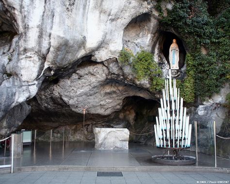 The Grotto in Lourdes France.  Truly a wonderful and spiritual place to visit.  Lourdes, France is a beautiful, wondrous little town best known for the famous grotto where the Virgin Mary is said to have appeared to St. Bernadette 18 times in 1858 Lourdes Grotto, Bernadette Soubirous, Cheap International Flights, Lourdes France, Spiritual Images, Honeymoon Places, Lady Of Lourdes, Our Lady Of Lourdes, Immaculate Conception