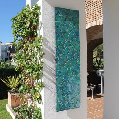 We design and make garden wall art made from ceramic. Our wall art is suitable for interiors and exteriors and handmade in Marbella, Spain. Exterior Wall Art, Wall Art Outdoor, Ceramic Wall Decor, Tile Wall Art, Ceramic Wall Art, Tile Wall, Mosaic Garden, Mosaic Wall Art, Outdoor Wall Art