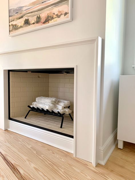 How We Built An Easy Modern Fireplace Mantel... Just In Time For Stockings! | Young House Love Fireplace Hearth Decor Modern, Contemporary Fireplace Surround, Small Diy Fireplace, Simple Wood Fireplace Surround, Modern Mantle Ideas, Mdf Fireplace Surround, Boho Fireplace Ideas, Pole Wrap Fireplace, Diy Fireplace Mantle Surround