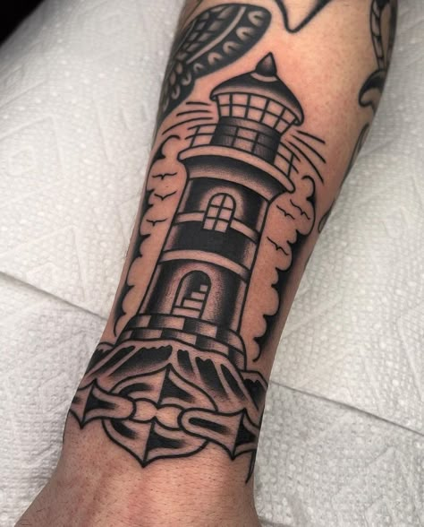 American Traditional Tattoos Men Black, Forearm Tattoos Men Unique, Globe Tattoo Men, American Traditional Gap Filler Tattoos, Tatto Old Scold, Metalhead Tattoo Ideas, Lighthouse Tattoo Traditional, Black And Gray Lighthouse Tattoo, Traditional Lighthouse Tattoo Black