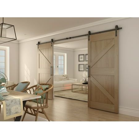 Are you in need of a good-quality double barn door hardware kit? You have come to the right place. Villar Home Designs presents a classical-style, double-sided sliding barn door kit that will make your life easier. Not only is the barn door kit easily installed, but it will also decrease the possibility of the door getting stuck during its use. High-quality, durable carbon steel was used to manufacture its parts, which greatly increases its lifecycle. This barn door hardware's stainless steel uses heavy-duty carbon steel to lift up to 230 lbs. Furthermore, this is combined with a special, scratch-resistant surface to minimize damage. Frequent use and accidental damage will not ruin its aesthetic or operation! This Black Double Barn Door Hardware Kit is available in multiple styles. Chose b Double Barn Doors Sliding, Black Sliding Barn Door, Modern Door Hardware, Beams Living Room, Garage To Living Space, Barn Door Kit, Double Barn Doors, Double Black, Door Kits