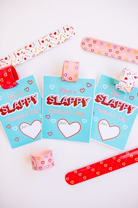 Grab this FREE Slap Bracelet Valentine Printable! Perfect for a fun slap bracelet Valentine card perfect to pass out for class Valentines!  It’s officially Valentine’s season, which means time to add Valentine class cards to the chore list. I’m half kidding, they are fun, but also can be more stressful than anyone needs. This is… Read More The post Slap Bracelet Valentine [With Free Printable] appeared first on Friday We're in Love. Valentine Candy Grams, Happy Heart Day, Printable Valentines Day Cards, Valentine's Day Printables, Valentine's Ideas, Kids Planner, Be Mine Valentine, Valentine Crafts For Kids, Valentines Printables Free