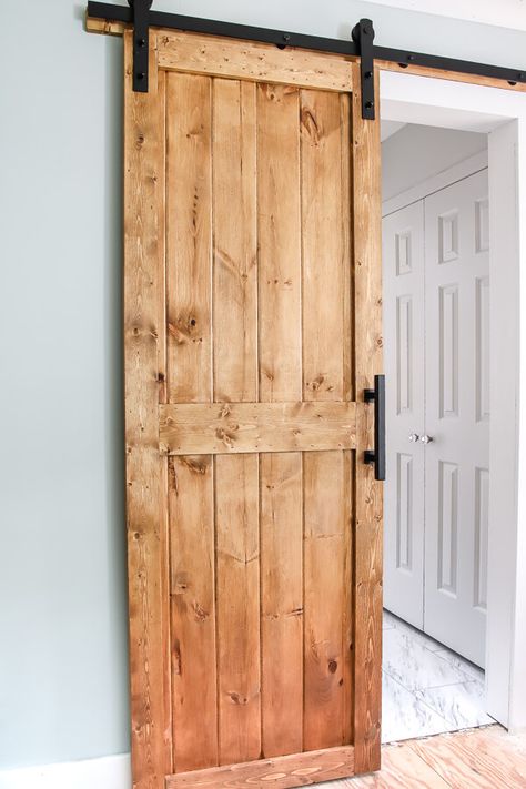 DIY barn door plans and tutorial. We snuck a little something on the back side of this door you have to see! #DIYbarndoor #barndoortutorial Diy Barn Door Cheap, Diy Barn Door Plans, Barn Door Ideas, Building A Barn Door, Door Plan, Diy Sliding Barn Door, Diy Barn, Barn Door Designs, Diy Barn Door