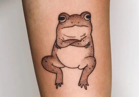 30 Coolest Frog Tattoo Designs Grumpy Frog Tattoo, Cartoon Frog Tattoo Ideas, Frog Minimalist Tattoo, Cool Frog Tattoo, Black And White Frog Tattoo, Old School Frog Tattoo, Frog Flash Tattoo, Traditional Frog Tattoo, Cute Frog Tattoo