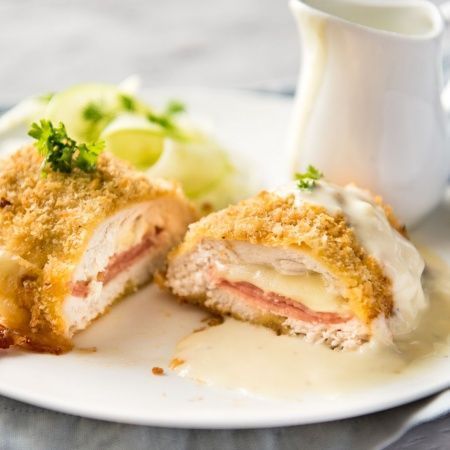 Easy Chicken Cordon Bleu - You are going to be amazed how easy it is to make this chicken stuffed with cheese and ham, coated in crunchy breadcrumbs and served with a gorgeous cheese sauce! www.recipetineats.com Cordon Bleu Sauce, Chicken Cordon Bleu Sauce, Baked Chicken Cordon Bleu, Easy Chicken Cordon Bleu, Cordon Bleu Recipe, Chicken Cordon Bleu Recipe, Cheese Stuffed Chicken, Recipetin Eats, Chicken Cordon