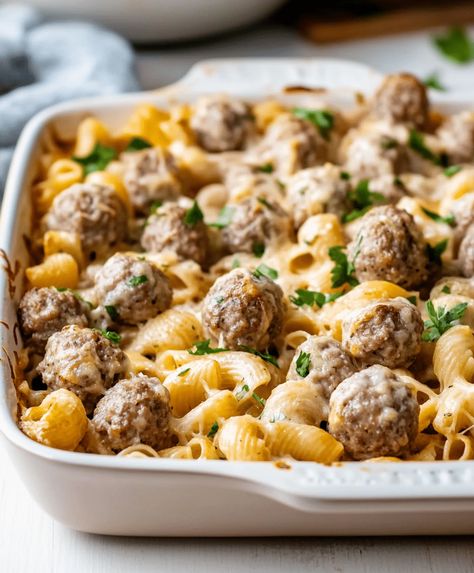 Creamy Swedish meatball pasta bake combines classic Swedish flavors with cheesy goodness for a hearty family meal. Ready in 1 hour! Swedish Meatball Bake, Swedish Meatball Pasta Bake, Meatball Pasta Bake Recipes, Swedish Meatball Pasta, Creamy Swedish Meatballs, Meatball Pasta Bake, Pasta Bake Recipe, Savory Meatballs, Meatball Pasta