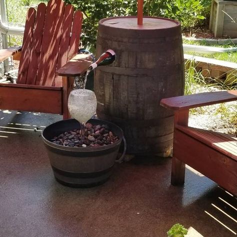 Wine Bottle Fountain - RYOBI Nation Projects Whiskey Barrel Water Feature, Diy Wine Barrel Water Fountain, Barrel Water Feature, Barrel Water Fountain, Wine Barrel Water Feature, Wine Barrel Fish Pond Diy, Jack Daniels Water Fountain, Wine Bottle Fountain, Bottle Fountain