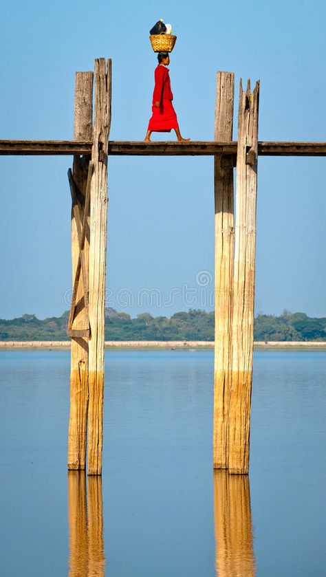 Walker on ubein bridge,myanmar. A woman in red walking across taungthaman lake on The 1,5 km long ubein teak bridge in Amarapura, central Myanmar royalty free stock photos Amarapura, Woman In Red, Water Glass, Myanmar, Free Stock Photos, Wine Glass, Teak, Photo Image, Royalty Free Stock Photos