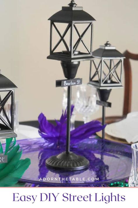 Black streetlight post Nola Party Decorations, Mardis Gras Tablescape, New Orleans Party Decor, Mardi Gras Table Centerpiece Ideas, Mardi Gras Centerpieces Diy, Mardi Gras Table Decorations, Mardi Gras Decorations Ideas, Diy Mardi Gras Decorations, Diy Lamp Post