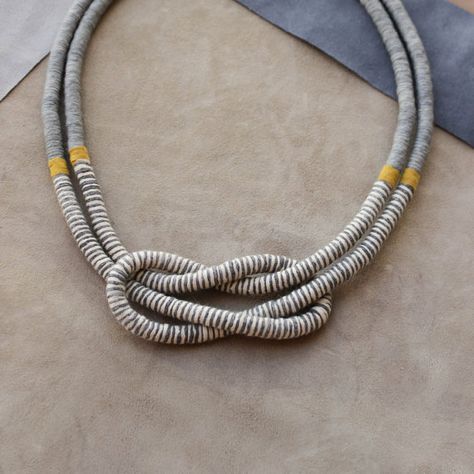 Beautiful square knot necklace made of rope hand-wrapped with gummed cotton yarn, part of grey yarn, part of striped grey and vanilla yarn, separated by yellow leather strip. Materials: polyester rope, 100 % cotton yarn, leather strip, metal clasp, leather badge.  The necklace is approximately 56 cm / 22 inches in length and one rope is approximately 0.7 cm / 0.27 inches in diameter. If you prefer longer or shorter necklace, please indicate.  The item is handmade by me, so it might ... Friendship Knot, Reef Knot, Necklaces Diy, Victoria Kay, Necklace Top, Jewellery Necklaces, Square Knot, Rope Chain Necklace, Gold Rope Chains