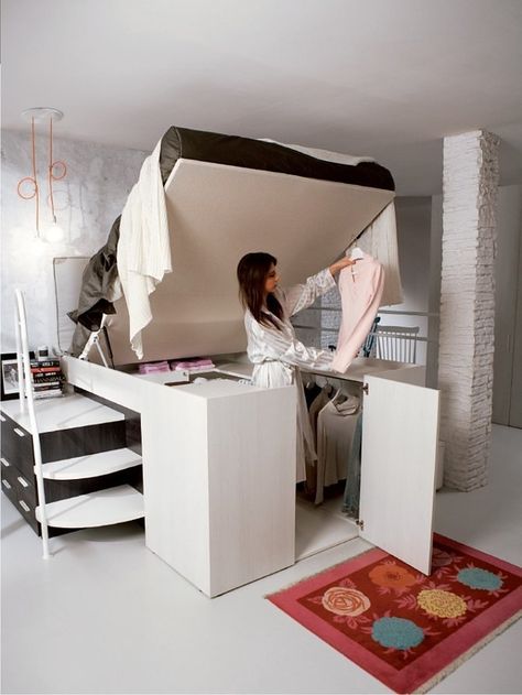 When not in use, this bed just looks tall and stylish. But really it's a cover for a smart closet under the lofted mattress — all you have to do is lift it up when you want to get dressed, then pull it down to make it all go away.  See more at Dielle.   - Cosmopolitan.com Cama Closet, Design Ložnic, Smart Closet, Space Saving Beds, Italian Designers, Built In Bed, Deli Food, Bed Plans, Folding Furniture