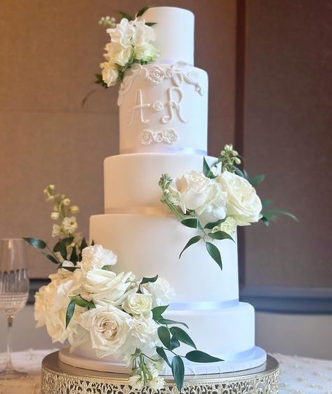 Smooth Fondant 5 tier cake with Bride & Grooms initials. The cake is styrofoam inside but we offer the option to have a cut out in the back for a slice of cake.  White satin ribbon around each tier is also included.  Florals and stand not included. Classic Tiered Wedding Cake, Four Tier Wedding Cakes, Simple Elegant Wedding Cakes, Modern White Wedding Cake, Timeless Wedding Cake, 5 Tier Cake, Faux Wedding Cake, All White Wedding Cake, 5 Tier Wedding Cake