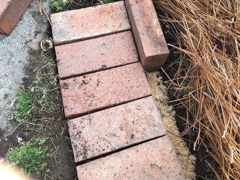 Repurposing leftover brick into lovely garden edging has never been easier. Find out how to complete this weekend project! Apparently, I like structure, and this flower bed seemed to be spilling out onto the lawn. Lucky for me, old patio bricks were stacked onto a pallet in the backyard and were waiting to be used. The project of creating the brick garden edging took a weekend, but I wasn’t working full days. Here’s what you’ll need to complete the project.Bricks (how many depends on h… Recycled Brick Garden Edging, Brick Edging For Flower Beds, Brick Flower Bed Border, Planter Design Ideas, Brick Flower Bed, Paver Sand, Brick Border, Brick Garden Edging, Charleston Gardens