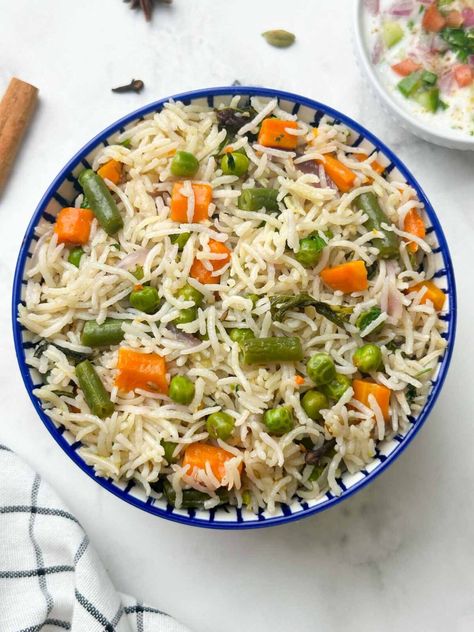 instant pot vegetable pulao served in a bowl with raita on the side Vegetable Pulao Recipe, Veg Pulao Recipe, Rice Dishes Easy, Vegetable Pulao, Veg Pulao, Pilaf Recipe, Pilaf Recipes, Indian Veg Recipes, Whole Spices