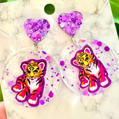 Lisa Frank Tiger Acrylic Sticker Earrings For Sale! These Earrings Are Absolutely Adorable. They Are Handmade By Me With Resin. Each Earring Has An Original Lisa Frank Sticker Imbedded In It. They Are About 2 Inches Tall And About 1 Inch Wide. They Are From My Boutique, And Are Absolutely Cute And One Of A Kind! Stickers In Resin, Lisa Frank Tiger, Ear Dressing, Sticker Earrings, Acrylic Sticker, Lisa Frank Stickers, Keychain Ideas, Beautiful Beaded Jewelry, 35th Birthday