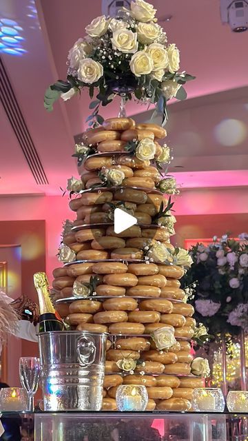 Anyaa | Content Creator on Instagram: "🍩 Here’s THREE REASONS why you need a doughnut tower at your wedding:

✨ When ordering the doughnuts, it also comes with a tower stand, and everything totals to around £420, saving you time, money & effort on set-up and transport!

✨No more leftover lonely cake! 
I have first-hand seen guests grabbing doughnuts throughout the night (and they’re perfect for on-the-go snacking!). Plus, no need for plates & forks

✨The tower holds a whopping 216 doughnuts. You can even choose all @krispykremeuk Original Glaze or a delightful assortment of all their flavours! 

Sounds like a winner to me 😏" Doughnut Tower, Tower Stand, Hand Saw, Set Up, Sounds Like, Forks, On Set, Content Creator, Save Yourself