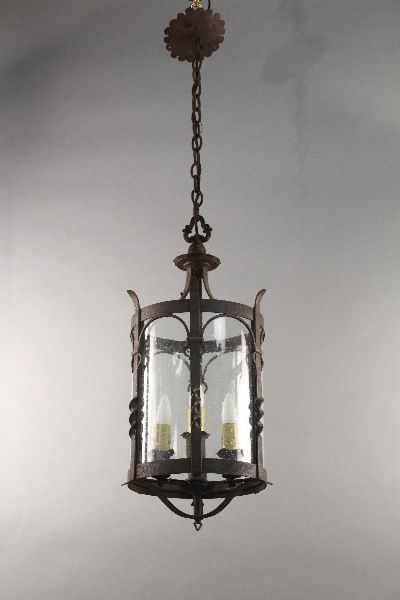 Wrought iron pendant with glass with three  lights.  Original finish.  27.5" H x 13.25" W x 13.25" D x 46.5" Total H with chain & canopy Spanish Colonial Pendant Light, Wrought Iron Pendant Light, Spanish Lighting, Monterey Furniture, Spanish Revival Home, Colonial Furniture, Glass Barn Doors, Iron Lanterns, Arts And Crafts Furniture