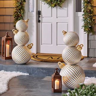 Oversized holiday accent for outdoor or indoor display . Whimsical version of a traditional porch topiary, over 3 ft. tall . Handpainted in shining silver and gold . Dimensional, ribbed texture closely mimics traditional ornaments . Sit directly on a flat surface or display in our Trianon Topiary Pedestal Planter (sold separately) . Durable and weather-ready, lasts for seasons to come . Polyester resin/styrene/fiberglass construction . Arrives in three separate sections with some assembly; no to Porch Topiary, Pedestal Planter, Traditional Porch, Traditional Ornaments, Gold Christmas Decorations, Christmas Porch Decor, Holiday Garlands, Polyester Resin, White Christmas Decor