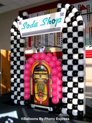 juke box decoration | Soda Shop with Juke Box creates a focal point for the lobby of an ... 50s Party Backdrop, Soda Shop Party Decor, 50s Theme Balloon Arch, 1950s Diy Decor, Grease Party Decorations Diy, 50s Balloon Decor, 50s Theme Decorations, 50s Diner Decorations, 1950s Prom Theme