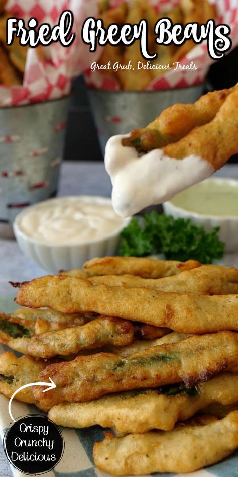 Closeup shot of frired green beans dipped in ranch over plate full of more fried green beans. Dip For Fried Green Beans, Deep Fried Green Beans Recipe, Crispy Fried Green Beans, Fried String Beans, Deep Fried Green Beans, Fried Green Beans Recipe, Non Traditional Thanksgiving, Oven Fried Green Beans, Rv Snacks