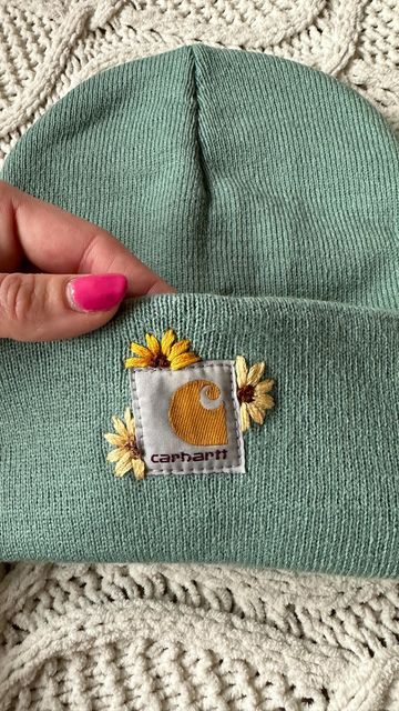 Diy Clothing Embroidery Courses | Hand Embroidery Kits on Instagram: "Comment SUNFLOWER and I’ll send you the link to this Carhartt beanie pattern. Hand embroidery makes a great hobby for busy mamas. Let’s make 2024 the year you commit to have some me time. The year you learn a new skill. The year you find something you love to do, for YOU." Embroidered Hats Ideas, Clothing Embroidery, Carhartt Beanie, Clothes Embroidery Diy, Hand Embroidery Kits, Hand Embroidery Projects, Embroidery Gifts, Hat Embroidery, Learn A New Skill