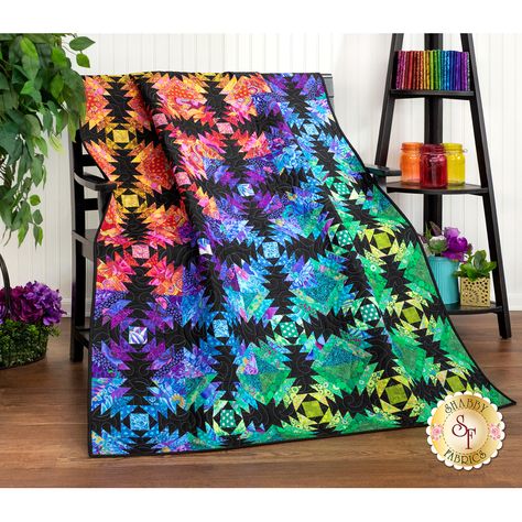 Dynamic and eye-catching, bright and energetic, the Pineapple Quilt is a showstopping one-of-a-kind project. Bold prints from the Kaffe Fassett collection and In The Beginning Fabrics' Prism II collection collaborate to create the mesmerizing rainbow effect. Quilt finishes at approximately 50-1/2" x 60-1/2". Limited Kits are available so Reserve your kit today! The Creative Grids Pineapple Trim Tool is Required to complete this quilt. This Trim Tool comes with the illustrated, step-by-step instr Pinehurst Quilt, Pineapple Quilt Pattern, Pineapple Block, Pineapple Quilt Block, Pineapple Quilts, Tim Holtz Fabric, Scrap Quilting, Pineapple Quilt, Laser Cut Kit