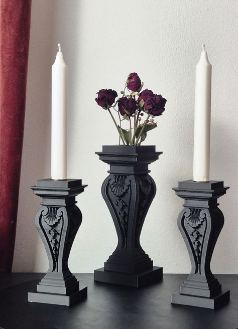 This unique set contains a gothic style vase and one or two fitting candleholders, crafted through 3D printing. If you're into all things Gothic - from the architecture to the lifestyle - this set is gonna be your new favorite thing to show off in your crypt. Vase: Width 40 mm/1.57 in Depth 40 mm/1.57 in Height 170 mm/6.69 in Weight 141 g/4.97 oz Please note, this vase is designed for decorative purposes only and is not suitable for holding water! Candle holder: Width 65 mm/2.56 in Depth 65 mm/2 Goth Style Living Room, Drip Candle Holder, Bedroom Decor Gothic, Classy Goth Home Decor, Romantic Gothic Decor, Gothic Desk Decor, Antique Gothic Decor, Gothic Apartment Aesthetic, Gothic Coffee Shop