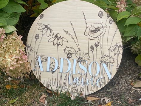 This Wooden Wildflower Nursery Name Sign has an engraved wildflower field on Birch Wood. Sign is half inch thick, and light weight. Childs name is laser cut out of quarter inch Birch wood, sanded and painted white for a 3D effect. Sign comes in multiple sizes: 8" & 10" for Baby Announcements or Photo Props, and 14", 16", & 18" for doors or walls. Large sizes for with a wall hanger attached. Wooden Baby Name Signs, Baby Door Signs, Wildflower Nursery, 3d Name, Baby Hangers, Baby Door, Wildflower Field, Nursery Name Sign, Engraved Flower