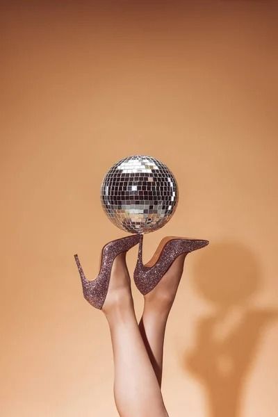 Cropped image of woman holding shiny disco ball on high heels at party on beige — effulgence, female - Stock Photo | #228179878 Photo Cropping, Heel Accessories, Poster Inspiration, Crop Image, Ladies Night, Female Images, Photo Images, Disco Ball, Branding Inspiration