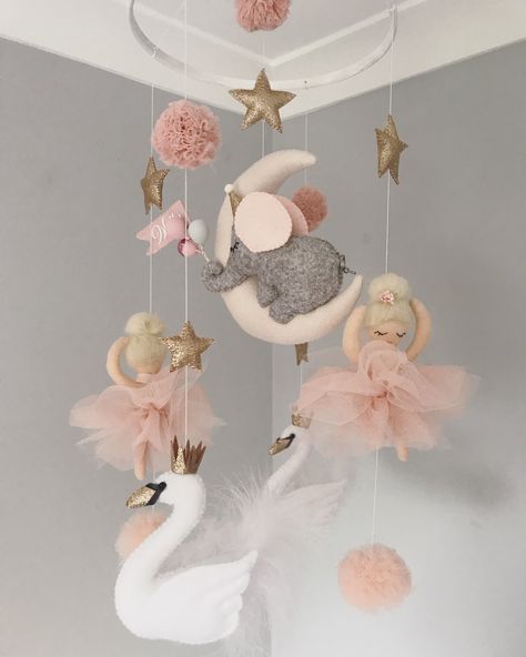 A stunning feature mobile with 2 Swans, 2 Ballerinas and a Elephant swinging on the moon. The Elephant holds balloons and a personalised flag with your baby’s name. This is a ceiling hanging mobile and hangs roughly 60cm down. This way it can stay up as a feature in your child’s room as long as you like. 2 Swans, Ballerina Nursery, Baby Swan, Princess Nursery, Baby Shower Presents, Ballerina Girl, Nursery Inspo, Ceiling Hanging, Hanging Mobile