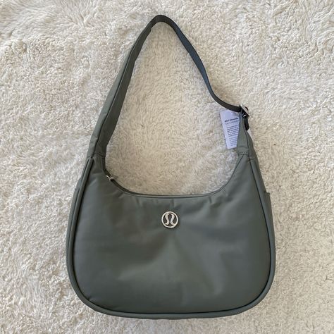 Lululemon Mini Shoulder Bag 4l Grey Sage Nwt Water-Repellent 100% Of The Nylon In This Product Is Recycled (Excluding Trims) Bag Dimensions: 29cm X 12cm X 17.5cm (11.4" X 4.7" X 6.9") Strap Length When Fully Extended: 32cm (12.6”) Volume: 4l Adjustable Shoulder Strap For Comfortable Carrying Exterior Zippered Pocket To Secure Your Valuables Side Drop-In Pockets Zippered Main Compartment Interior Pockets Hold The Essentials Mesh: 100% Recycled Polyester Lining: 100% Recycled Polyester Body: 100% Lululemon Mini Shoulder Bag, Lululemon Bags, Free Tote, Makeup Bag Organization, Festival Bag, Yoga Bag, Mini Shoulder Bag, Black Tote, Bag Handle