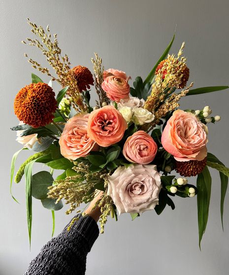 FALL2203,AUTUMN BOHEME Fall colors translated into soft, romantic hues and lush textures come together in our Autumn Boheme. This modern take on fall features peach and beige roses, white ranunculus, hypericum berries, corn broom, millet, brown disbud, and eucalyptus based on white hydrangea that showcases the soft side of autumn! (No Vase Included in Wrap) Wrapped Bouquet, Beige Roses, Pincushion Protea, Fall Floral Centerpieces, Poinsettia Care, Blooming Succulents, New Baby Flowers, Thanksgiving Floral, Orange Shades