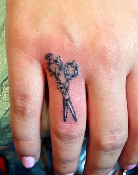 Small finger’s scissor tattoo Hair Scissor Tattoos, Scissor Tattoos, Cosmetology Tattoos, Shears Tattoo, Sagittarius Tattoos, Hairdresser Tattoos, Hairstylist Tattoos, Sewing Tattoos, Barber Tattoo