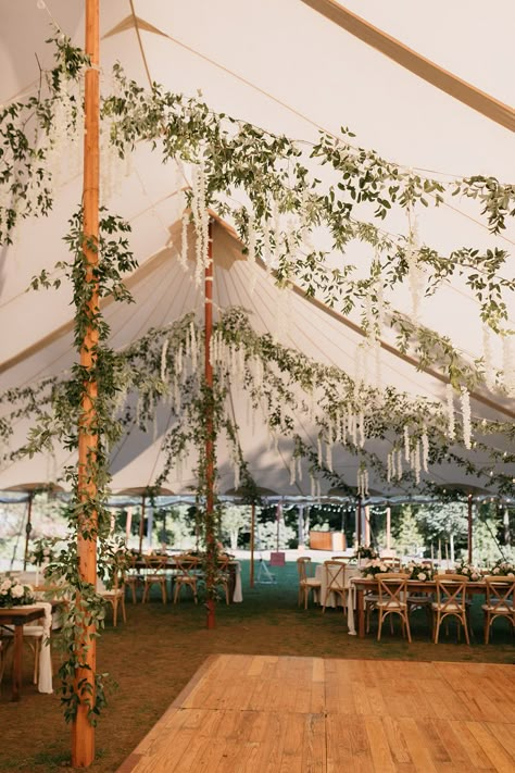 Wedding under sailcloth tent with hanging smilax vine greenery and white wisteria flowers Vintage Tent Wedding, Tent Engagement Decorations, Forest Tent Wedding, Decorating A Wedding Tent, Whimsical Tent Wedding, Wildflower Tent Wedding, Spring Tent Wedding, Wedding Tent Diy, Wedding Tent Greenery