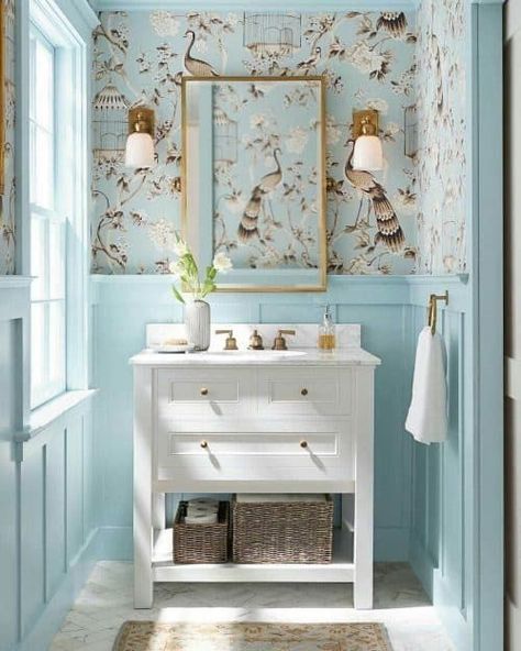 The easiest place to begin your Granny Chic transformation is in the half bath. It’s a smaller space that can typically be transformed. Grandmillenial half bath. With these Grandmillennial Decor Ideas, let's make granny chic, grand including examples of Grandmillennial living rooms, paint colors, bedrooms, and more. #Grandmillennial #halfbath #Grandmillennialdecor Pale Blue Paint Colors, Makeover Kamar Mandi, Blue Wall Colors, Light Blue Walls, Bad Inspiration, Blue Paint Colors, Trendy Bathroom, Bathroom Wallpaper, Home Design Decor