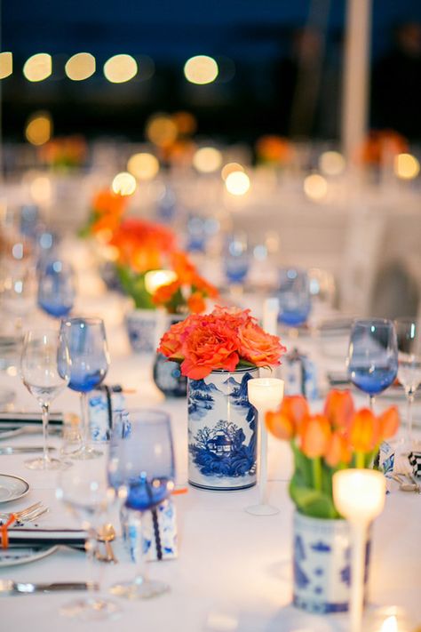 Navy And Orange Party Decor, Blue White And Orange Tablescape, Navy Blue And Orange Centerpieces, Colorful Confetti Wedding, Blue And Orange Tablescape, Dutch Wedding Theme, Wedding Blue Orange, Dutch Themed Wedding, Delft Wedding Theme