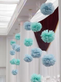 hanging tissue paper pom poms will create a beautiful backdrop and a cool party decoration. You can do this for baby showers, bridal showers, birthday parties and even wedding reception Head Table Wedding Backdrop, Blue Pom Poms, Wedding Pom Poms, Tissue Paper Decorations, Christening Decorations, Diy Fleur, Tissue Pom Poms, Christening Party, Fleurs Diy