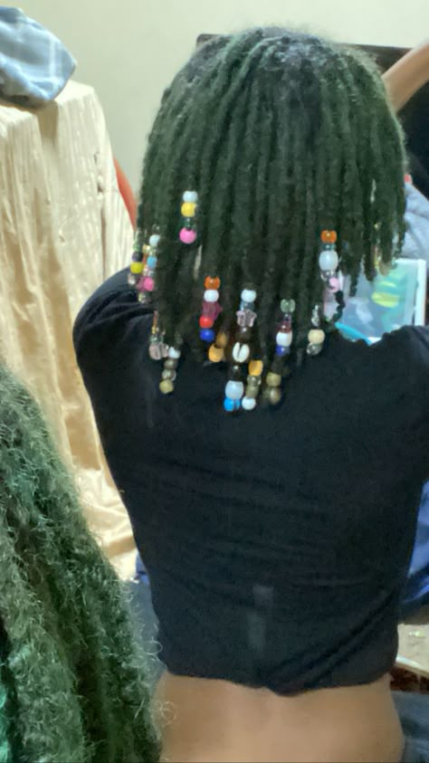 Dyed Locs Green, Green Dreadlocks Black Women, Beads On Dreads Locs, Green Locs Men, Green Natural Hair Black Women, Green And Black Locs, Green Butterfly Locs, Locs With Beads Black Women, Decorated Locs