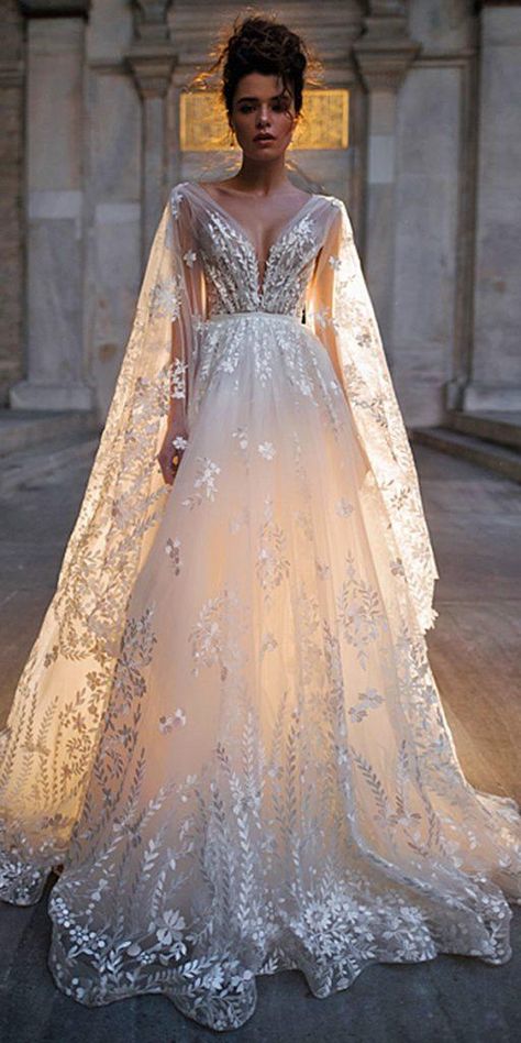 Blammo Biamo Wedding Dresses For Stylish Bride | Wedding Dresses Guide Wedding Dresses With Cape Sleeves, Aline Wedding Dress With Cape, Cape Sleeves Wedding Dress, Wedding Dresses Feathers, Blammo Biamo, Wedding Dress Cape, Wedding Dress With Cape, Fantasy Wedding Dress, Stylish Bride