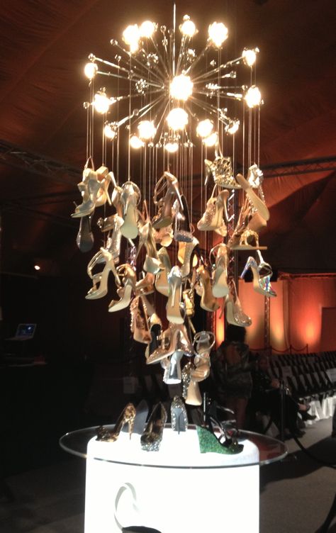 @jenniferbernard Muses centerpieces!!  Fabulous Brown Shoe Company shoe chandelier at St. Louis Fashion week Shoe Chandelier, Shoes Window Display, Old Ballet Shoes Display, Footwear Window Display, Vivienne Westwood Window Display, Holiday Window Displayfurniture Stores, Shoe Store Design, Muses Shoes, Display Props