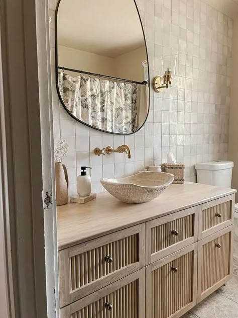 a beautiful neutral bathroom with Zellige tiles, a large reeded vanity, a bowl sink, an irregular shaped mirror and some chic decor Drømme Bad, Koti Diy, Bilik Air, Interior Boho, 아파트 인테리어, Bathroom Inspiration Decor, Bathroom Renos, Bathroom Inspo, House Bathroom