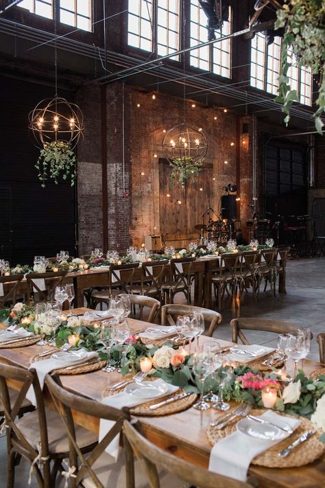 Romantic Industrial Wedding. | #griffingriffinlighting #mainewedding #weddinglighting #maineweddinglighting #lightingdesign #weddingdesign #modernwedding #realwedding #industrialwedding #weddingchandelier #weddingflowers #weddingcenterpieces #weddingtable #weddingreception Natural Wood Beams, Speakeasy Theme, Industrial Loft Wedding, Industrial Wedding Reception, Industrial Brick, Meghan Wedding, Warehouse Party, Austin Garden, Industrial Wedding Decor