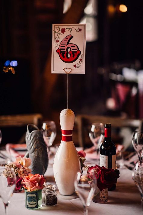 Fun bowling pin wedding table centrepiece with table number sign Bowling Rehearsal Dinner, Bowling Alley Wedding, Fairground Wedding, Bowling Wedding, Carnival Wedding Theme, Wedding Table Centrepieces, Midnight Circus, Wedding Table Centrepiece, Retro Wedding Theme