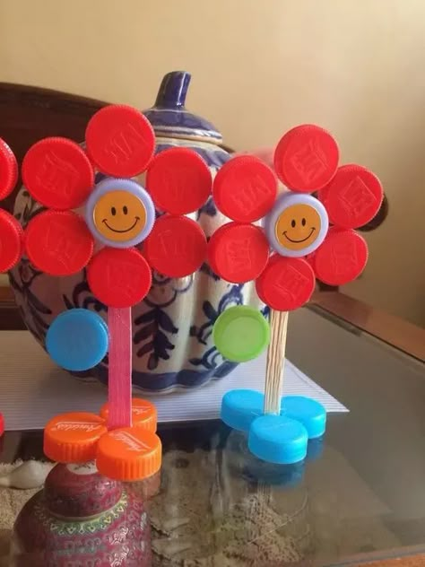 65+ Adorably Easy Spring Crafts for Kids - HubPages Bottle Top Crafts, Rolled Paper Flowers, Plastic Bottle Caps, Alphabet Crafts, Spring Crafts For Kids, Bottle Cap Crafts, Plastic Bottle Crafts, Tissue Paper Flowers, Diy Bottle