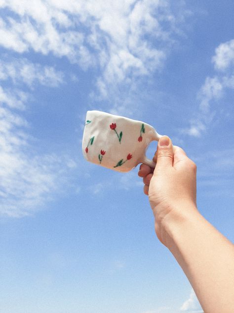 by @bymyoka This coffe mug is one of my most popular mugs! This baby is handbuilt and hand-glazed with the brush. Tulip patteren is perfect for joyful spring and summer days!🌷 In case you are interested and want to see more of my designs you can find me on instagram; feel free to contact me💕 Tulip Mug Pottery, Tulip Pottery Painting, Handbuilt Mug, Tulip Pottery, Tulip Mug, Ceramic Tulip, Handmade Mugs, Tulip Painting, Handmade Cups