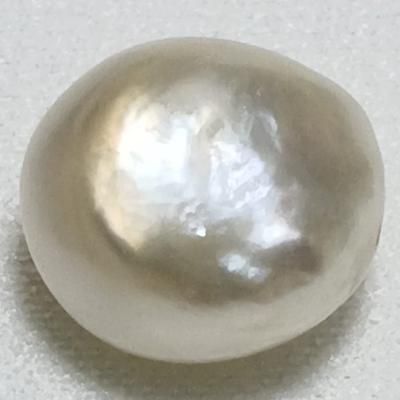 Basra Natural Pearl 8.70 Carat Button Shape 11mm: Type of pearl: Basra Natural Pearl   Weight: 8.70 carats  Shape: Button   Size: 11.98 x 11.10 x 8.71mm  Color: Light Cream  Location of Origin: Bahrain Unique Shell-shaped Pearl Jewelry, Clam Pearl, Shell-shaped Pearl Pendant For Beach, Blue Mussel, White Shell-shaped Pearl Earrings, White Shell-shaped Pearl Drop Earrings, Adjustable Shell-shaped Pearl White Jewelry, Natural Pearl Jewelry, Conch Pearl