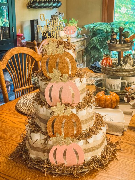 October/Fall Diaper Cake for a girl that I made Pumpkin Diaper Cake Girl, Fall Diaper Cake, Pumpkin Diaper Cake, Diaper Cake Girl, Thanksgiving Baby Shower, Cake Girl, Cowboy Baby Shower, Cowboy Baby, Thanksgiving Baby